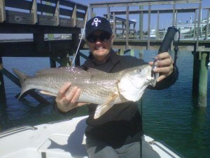 NC inshore fishing charters client with a redfish